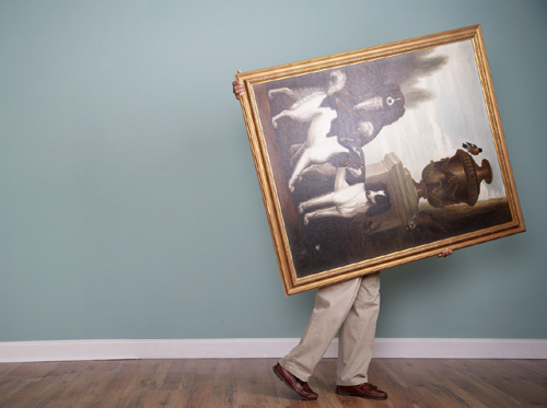 Man Carrying Large Painting